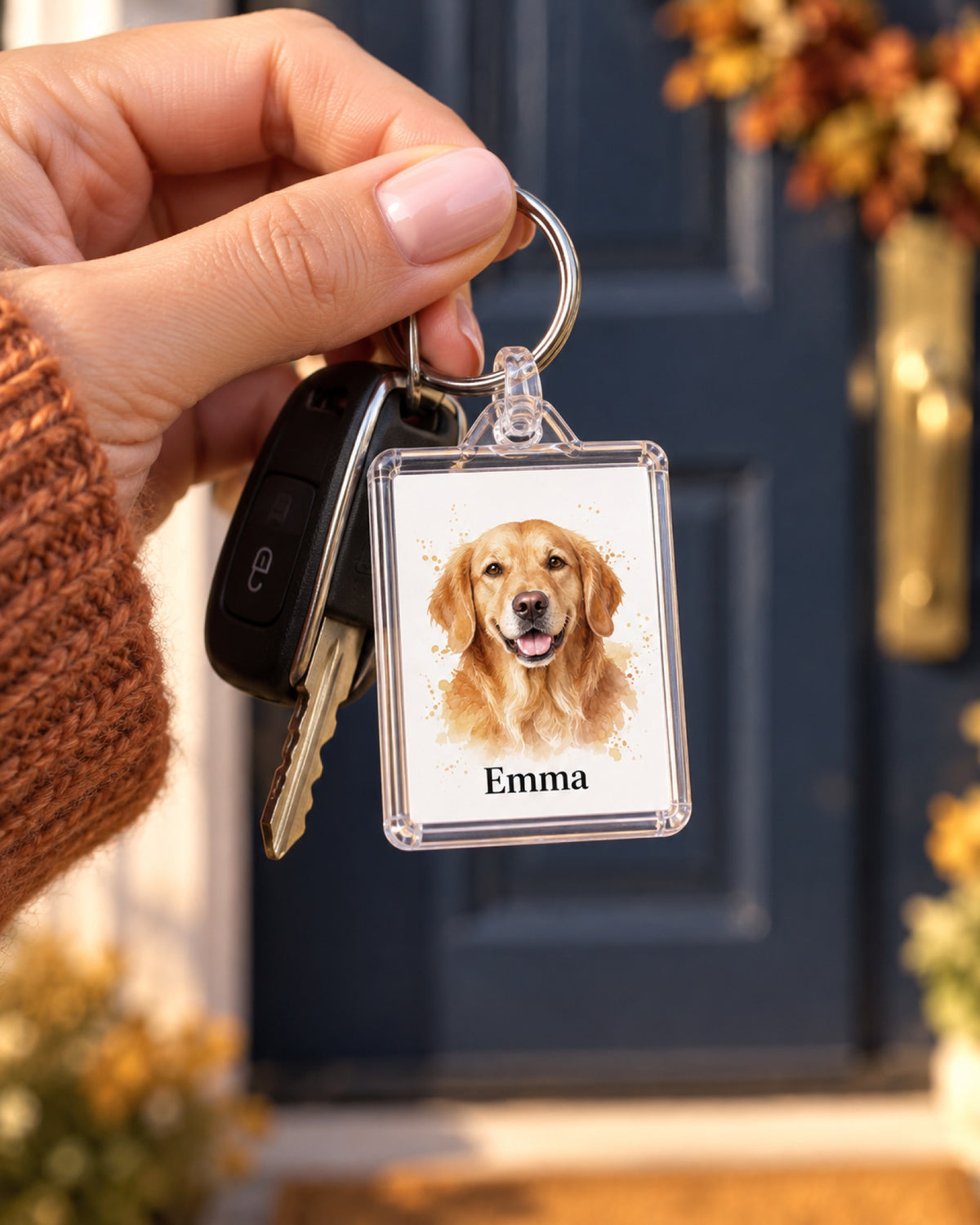 Rechteckiger transparenter Schlüsselanhänger mit Golden Retriever Emma in der Hand
